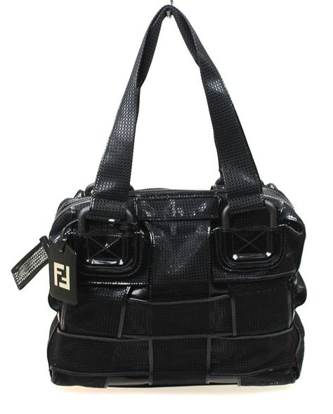 christian louboutin shoes or a fendi bag crossword clue